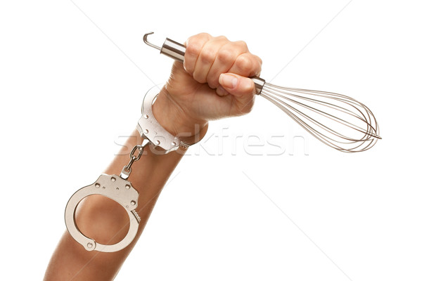 Stock photo: Handcuffed Woman Holding Egg Beater in Air on White