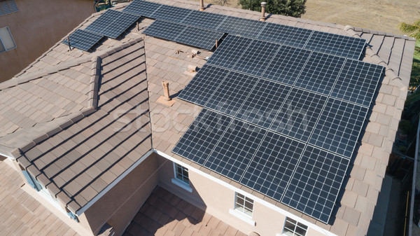 Solar Panels Installed on Roof of Large House Stock photo © feverpitch