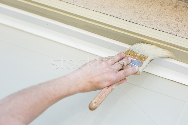 Professional Painter Cutting In With Brush to Paint Garage Door  Stock photo © feverpitch