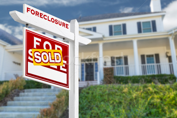 Left Facing Foreclosure Sold For Sale Real Estate Sign in Front  Stock photo © feverpitch