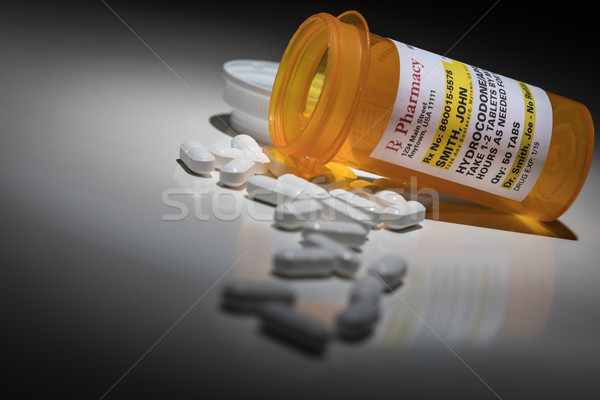 Hydrocodone Pills and Prescription Bottle with Non Proprietary L Stock photo © feverpitch