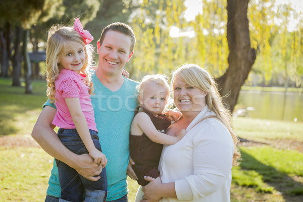 Young Attractive Family Portrait in the Park Stock photo © feverpitch