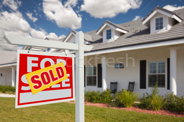 Sold Real Estate Sign and House - Left Stock photo © feverpitch