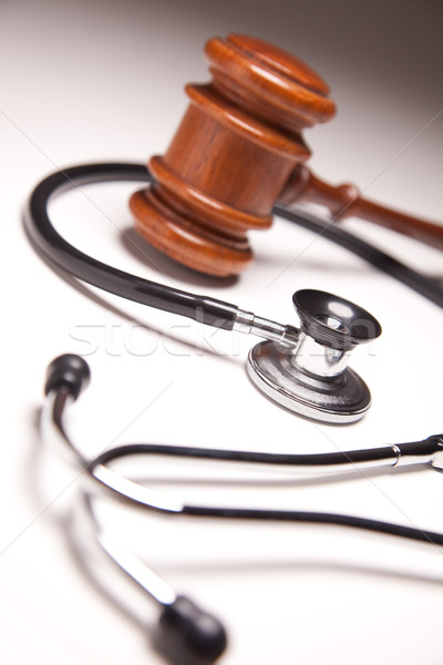 Gavel and Stethoscope on Gradated Background Stock photo © feverpitch
