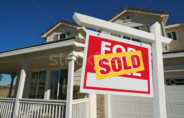 Sold Home For Sale Sign & New Home Stock photo © feverpitch