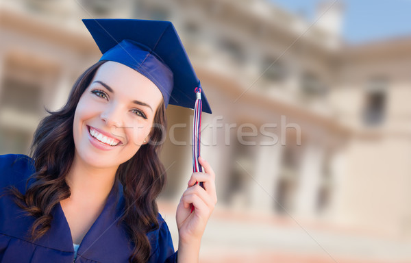Stock photo: Happy Graduating Mixed Race Woman In Cap and Gown Celebrating on