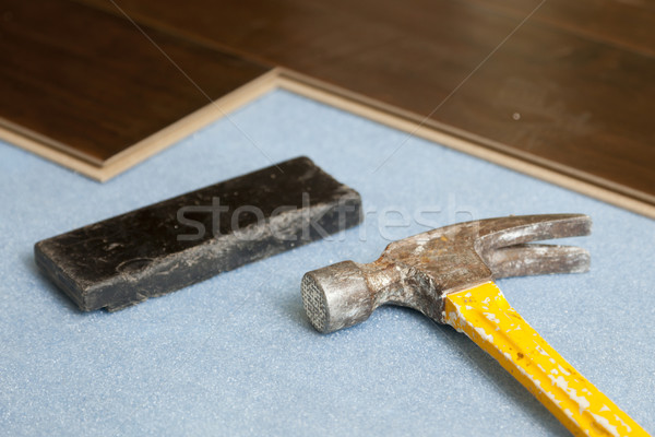 Hammer and Block with New Laminate Flooring Stock photo © feverpitch