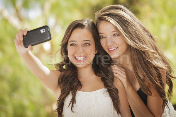 Attractive Mixed Race Girlfriends Taking Self Portrait with Came Stock photo © feverpitch