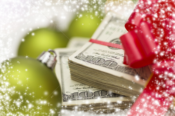 Stack of Hundred Dollar Bills with Bow Near Christmas Ornaments Stock photo © feverpitch