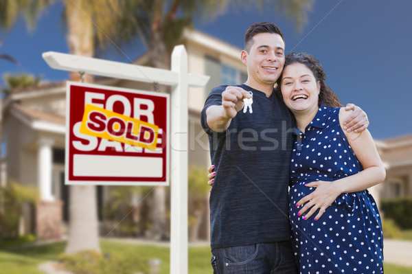 Hispanic Couple, Keys, New Home and Sold Real Estate Sign Stock photo © feverpitch