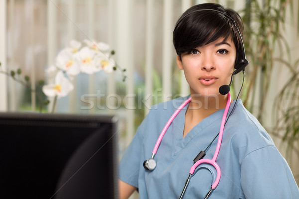 Vonzó több nemzetiségű nő visel headset cserjék Stock fotó © feverpitch