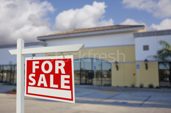 Vacant Retail Building with For Sale Real Estate Sign Stock photo © feverpitch