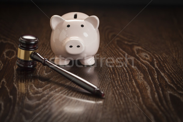 Gavel and Piggy Bank on Table Stock photo © feverpitch