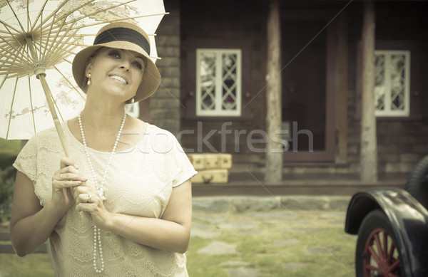 Stock photo: 1920s Dressed Girl with Parasol Near Vintage Car Portrait