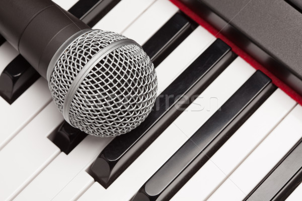 Microphone Laying on Electronic Synthesizer Keyboard Abstract Stock photo © feverpitch