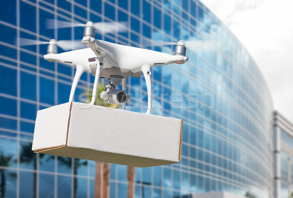 Unmanned Aircraft System (UAS) Quadcopter Drone Carrying Blank P Stock photo © feverpitch
