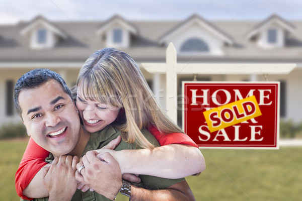 Mixed Race Couple in Front of Sold Real Estate Sign and House Stock photo © feverpitch