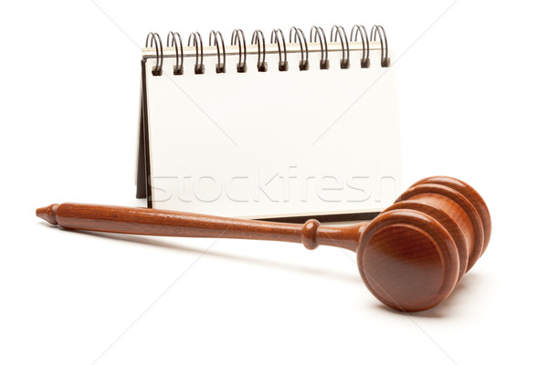 Blank Spiral Note Pad and Gavel on White. Stock photo © feverpitch