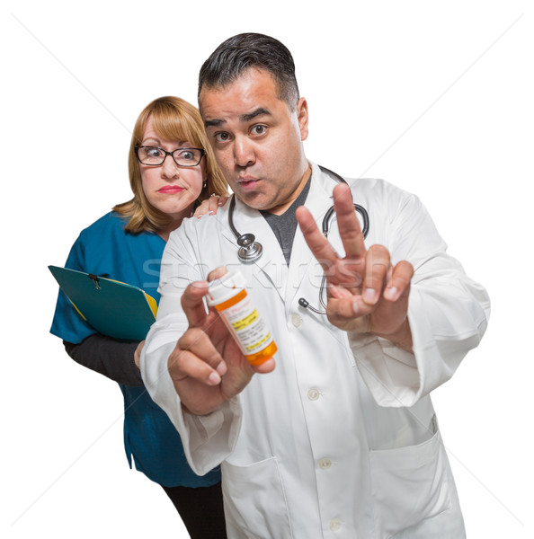 Goofy Doctor and Nurse with Prescription Bottle Isolated on a Wh Stock photo © feverpitch