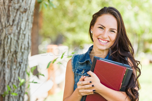 Attractive Smiling Mixed Race Young Girl Student with School Boo Stock photo © feverpitch