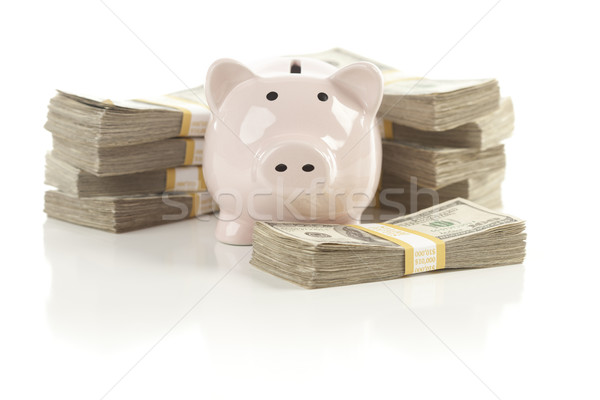 Pink Piggy Bank with Stacks of Money Stock photo © feverpitch