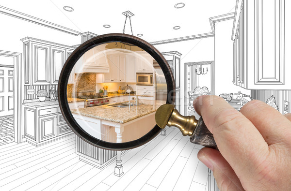 Hand Holding Magnifying Glass Revealing Custom Kitchen Design Dr Stock photo © feverpitch