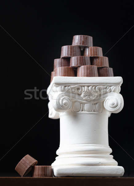 Stack of Fine Artisan Chocolates Stacked On White Pillar Column Stock photo © feverpitch