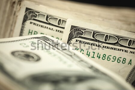 Roll of One Hundred Dollar Bills Tied in Burlap String on White Stock photo © feverpitch
