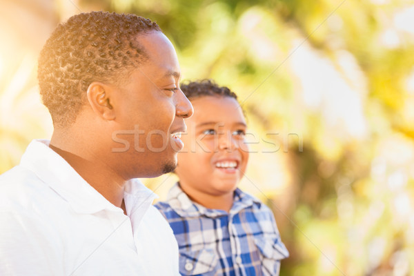 Mixed Race Son and African American Father Playing Outdoors Toge Stock photo © feverpitch