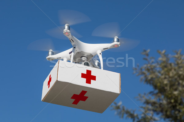 Unmanned Aircraft System (UAS) Quadcopter Drone Carrying First A Stock photo © feverpitch