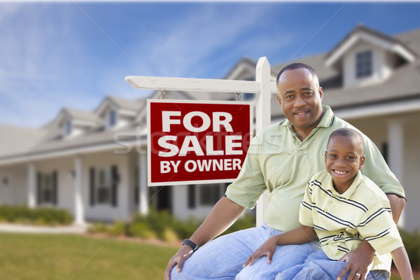 Father and Son In Front of For Sale By Owner Sign and House Stock photo © feverpitch