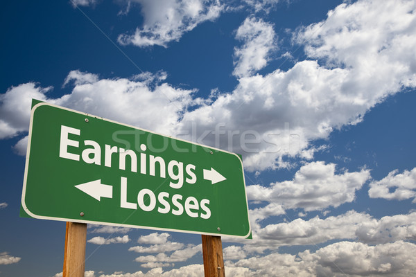 Earnings, Losses Green Road Sign Over Clouds Stock photo © feverpitch