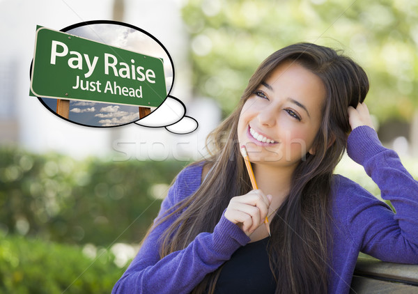 Young Woman with Thought Bubble of Pay Raise Green Sign  Stock photo © feverpitch