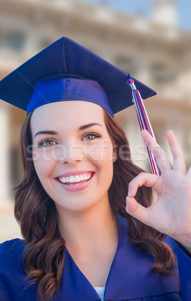 Happy Graduating Mixed Race Woman In Cap and Gown Celebrating on Stock photo © feverpitch
