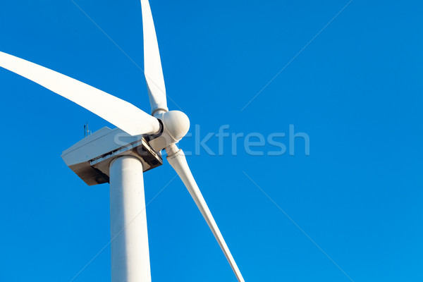 Single Wind Turbine Over Dramatic Blue Sky Stock photo © feverpitch