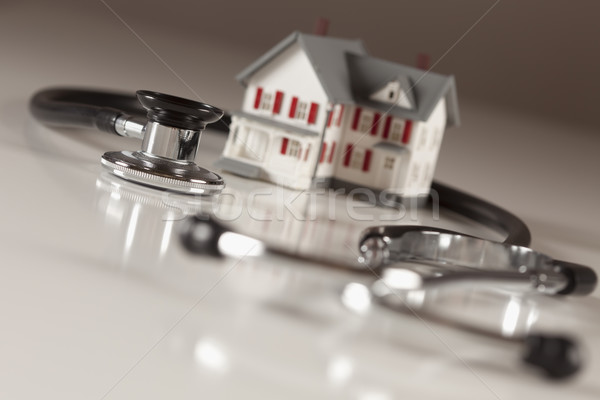 Stock photo: Stethoscope with Small Model Home