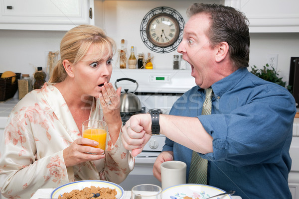 Stressed Couple in Kitchen Late for Work Stock photo © feverpitch