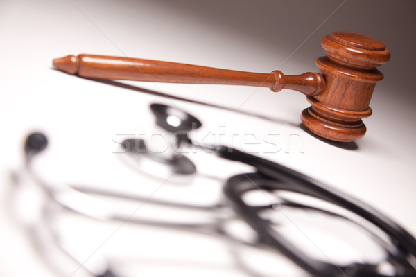 Gavel and Stethoscope on Gradated Background Stock photo © feverpitch