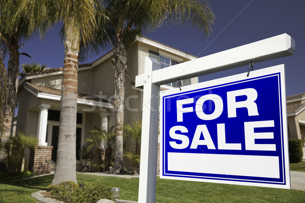 Stock photo: For Sale Real Estate Sign and House