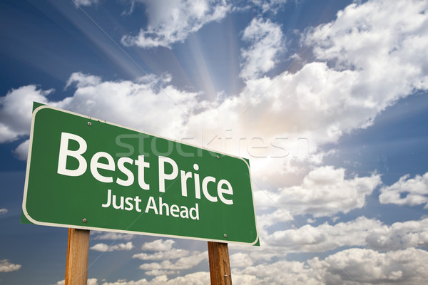 Best Price Green Road Sign Over Clouds Stock photo © feverpitch