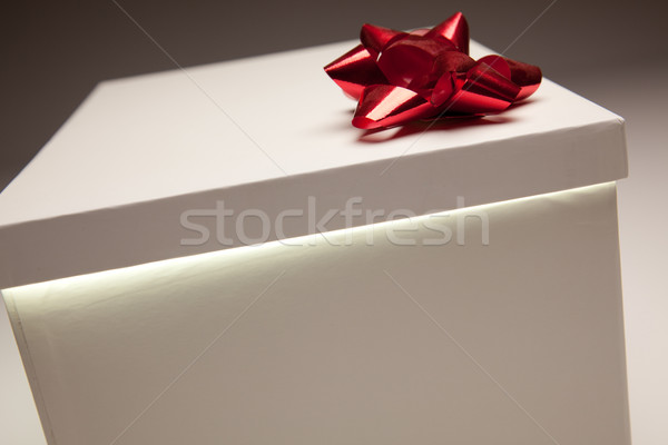 Red Bow Gift Box Lid Showing Very Bright Contents Stock photo © feverpitch
