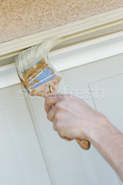 Professional Painter Cutting In With Brush to Paint Garage Door  Stock photo © feverpitch