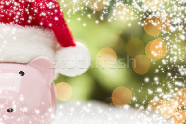 Stock photo: Pink Piggy Bank with Santa Hat on Snowflakes