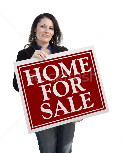 Stock photo: Hispanic Woman Holding Home For Sale Real Estate Sign