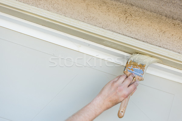 Professional Painter Cutting In With Brush to Paint Garage Door  Stock photo © feverpitch