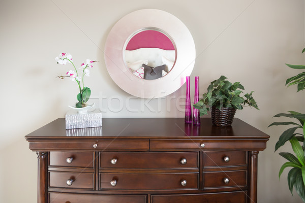 Stock photo: Beautiful Dresser and Mirror Against a Wall in a Home.