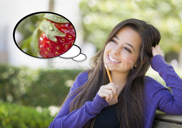 Stock photo: Pensive Woman with Strawberry Inside Thought Bubble