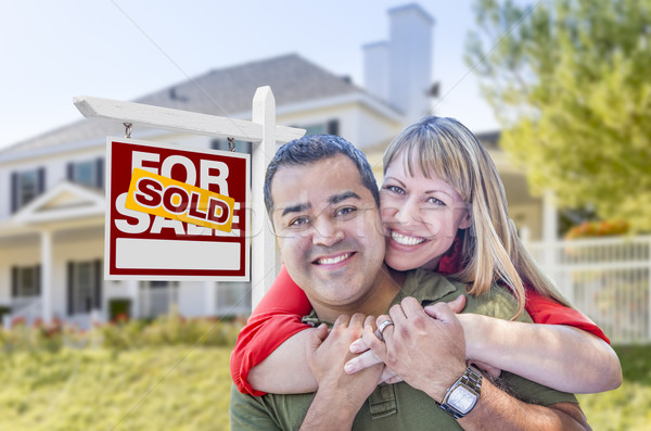 Couple in Front of Sold Real Estate Sign and House Stock photo © feverpitch