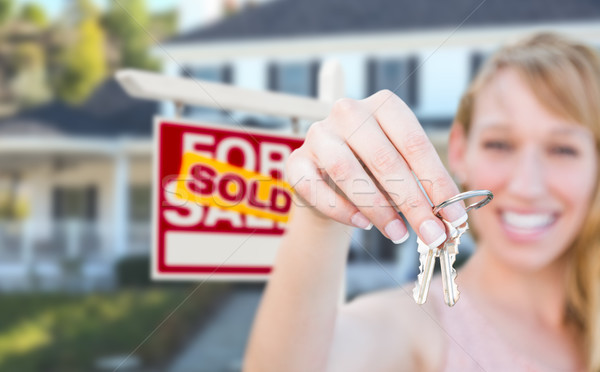 Excited Woman Holding House Keys and Sold For Sale Real Estate S Stock photo © feverpitch