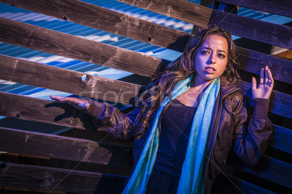 Frightened Pretty Young Woman in Dark Walkway at Night Stock photo © feverpitch